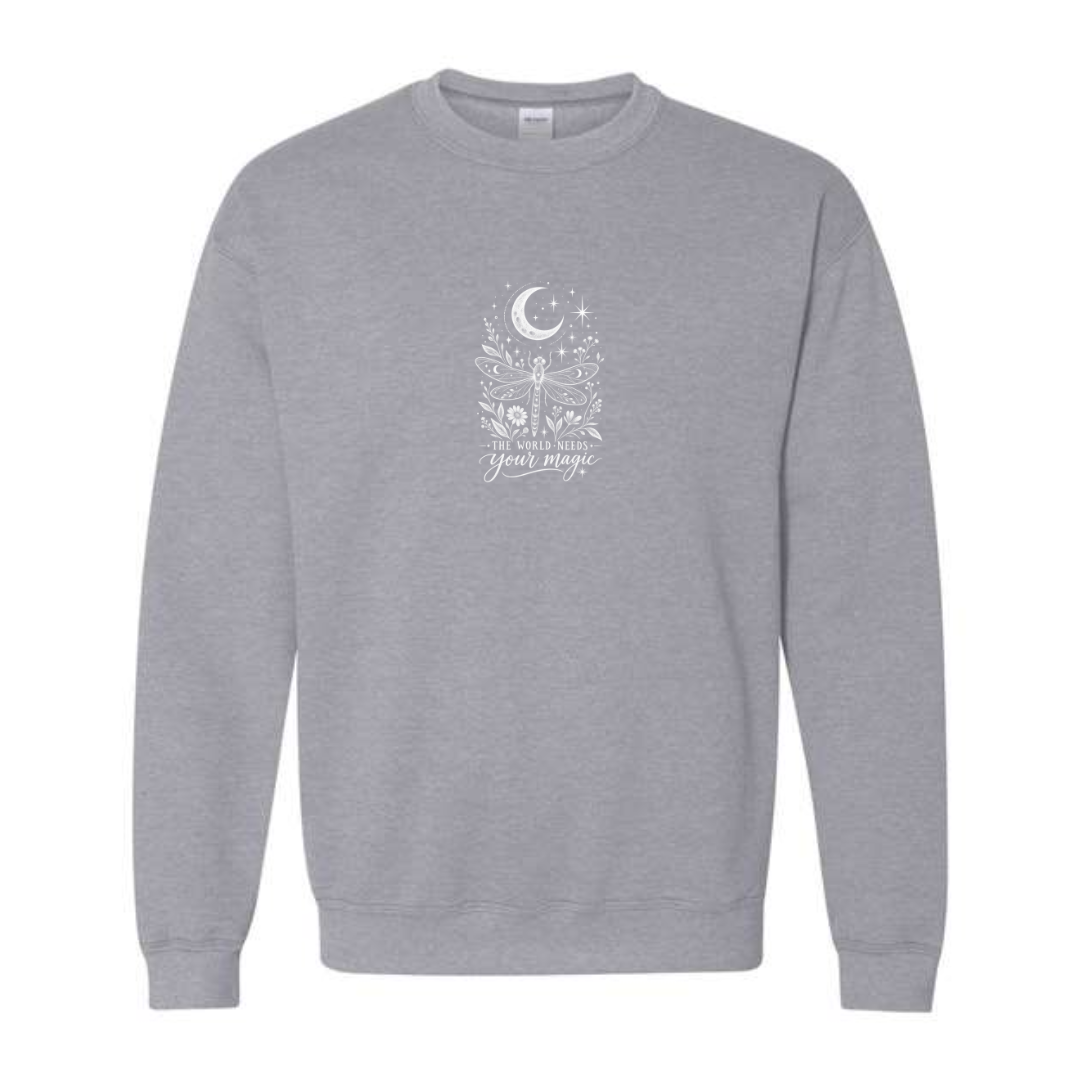 The World Needs Your Magic design on grey crewneck sweatshirt