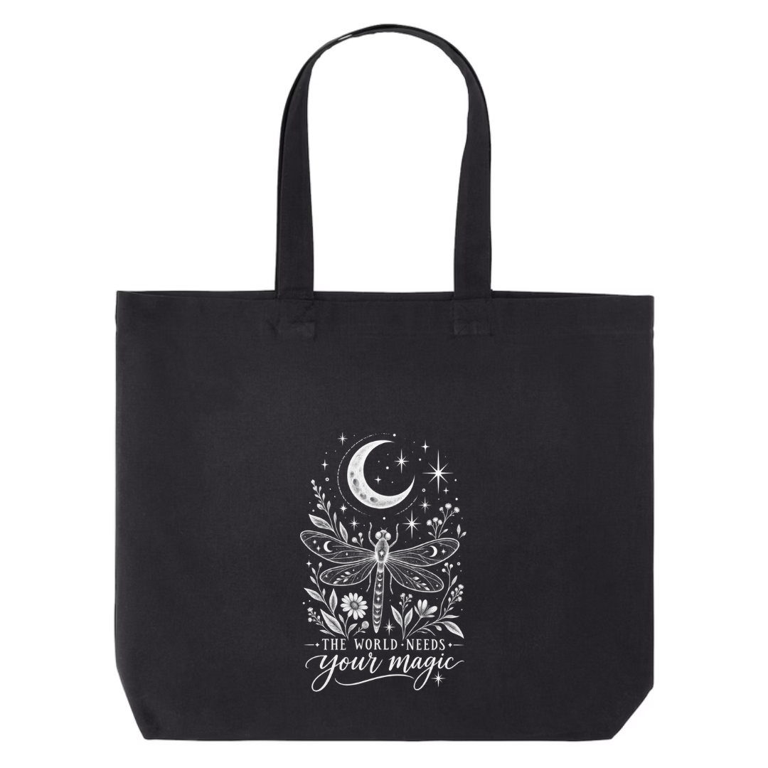 The World Needs Your Magic design on black canvas tote