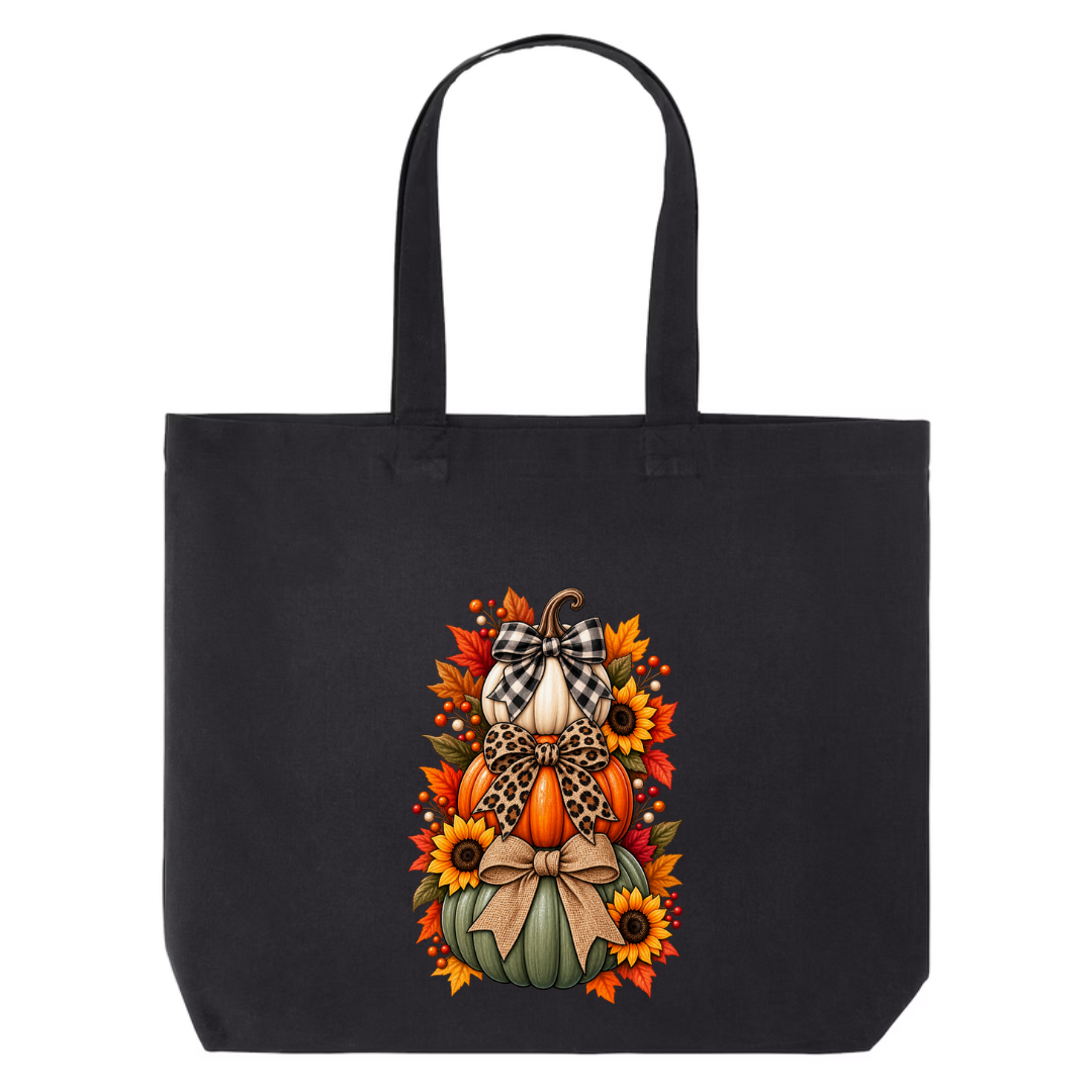 Stacked Pumpkins With Bows design on black canvas tote